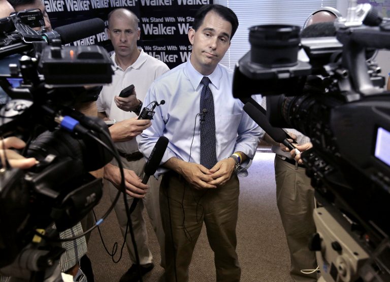 Wisconsin Governor Scott Walker addresses members of the media during a stop at the Madison GOP Field Office in Madison, Wis., Wednesday, July 22, 2014. (AP Photo/Wisconsin State Journal, John Hart)