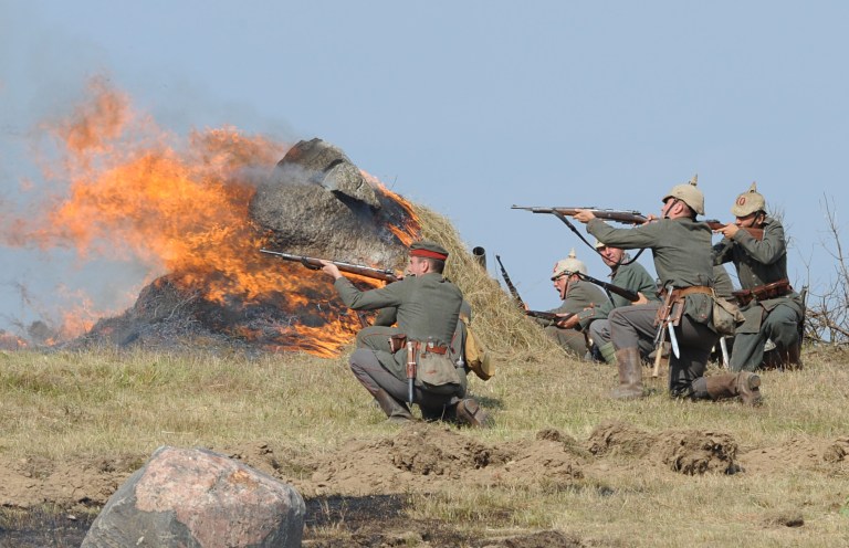 Actors dressed as German soldiers take part in the re-enactment of the 1914 Battle of Tannenberg in Szkotowo, Poland, Sunday, July 27, 2014, marking the 100th anniversary of the beginning of World War I. History enthusiasts from across Europe gathered to reconstruct the Battle of Tannenberg, an engagement between the Russian and German Empires in the first days of World War I.  (AP Photo/Alik Keplicz)