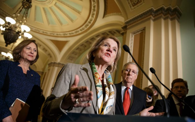 Sen. Shelley Moore Capito, R-W.Va., flanked by Senate Majority Leader Mitch McConnell of Ky., right, and Sen. Deb Fischer, R-Neb., left, speaks to reporters on Capitol Hill in Washington, Tuesday, Jan. 20, 2015, after a weekly Republican policy meeting. (AP Photo/J. Scott Applewhite)