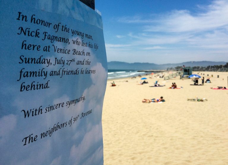 A memorial sign is posted on the Venice Beach pier in Los Angeles Monday, July 28, 2014. Los Angeles' popular Venice Beach teemed with people enjoying a weekend outing on the boardwalk and sand when lifeguards and other witnesses say lightning from a rare summer thunderstorm hit without warning, injuring or rattling more than a dozen people and leaving a 21-year-old man dead. Nick Fagnano, of Los Angeles, was a 2012 Notre Dame High School graduate, was killed after lightning struck Venice Beach on Sunday afternoon, (AP Photo/Damian Dovarganes)