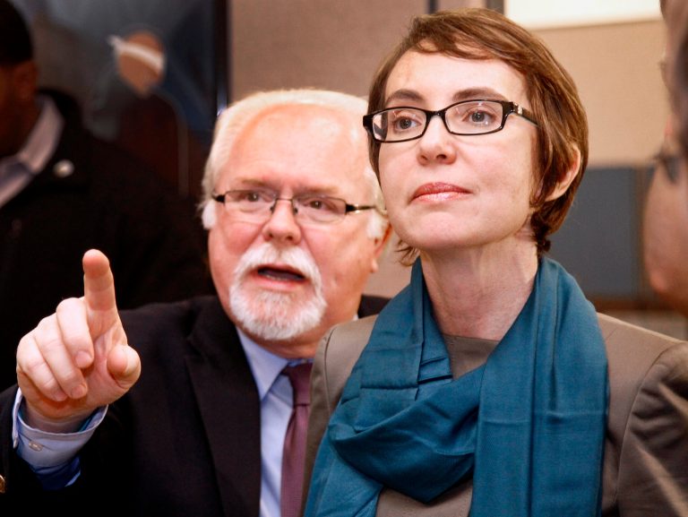   FILE - In this Jan. 23, 2012 file photo shows then-Rep Gabrielle Giffords, D-Ariz., tours the Gabrielle Giffords Family Assistance Center with staff member Ron Barber in Tucson, Ariz. In a special election in Arizona, Gabrielle Giffords' hand-picked House successor battles the Republican she narrowly beat just months before she was shot. Virginia, Maine, Nevada and South Carolina also have primary elections, as does North Dakota, where voters will decide whether the University of North Dakota should save or scrap its Fighting Sioux nickname. (AP Photo/Matt York, Pool, File)  