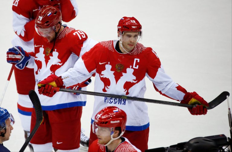 Russia defenseman Andrei Markov, left, and forward Pavel Datsyuk react after Russia lost 3-1 to Finland in a men's quarterfinal ice hockey game at the 2014 Winter Olympics, Wednesday, Feb. 19, 2014, in Sochi, Russia. (AP Photo/Mark Humphrey)