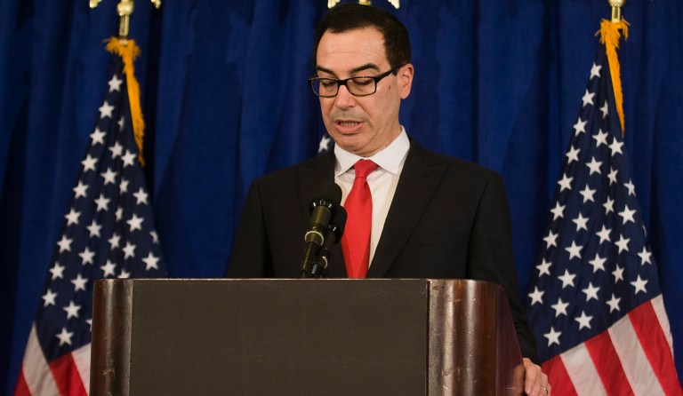 Treasury Secretary Steven Mnuchin defended President Trump's comments on the NFL Sunday, saying that sports leagues should question whether their players should be allowed to refuse to stand during the national anthem. (AP Photo/Andres Kudacki)