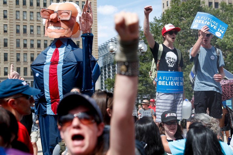 Bernie Sanders supporters at the DNC insist their revolution will go on, even without the Vermont senator's presidential campaign. (AP Photo/John Minchillo)