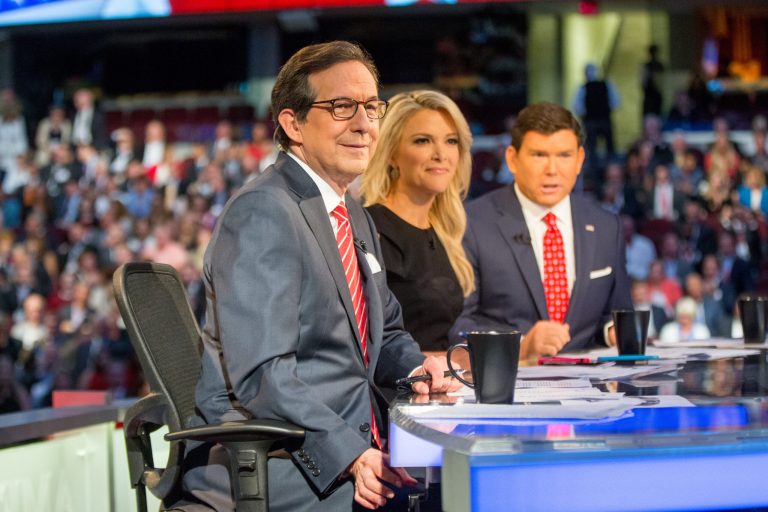 Fox News moderators from left, Chris Wallace, Megyn Kelly and Bret Baier speak to the camera before Republican presidential candidates New Jersey Gov. Chris Christie, Sen. Marco Rubio, R-Fla., Ben Carson, Wisconsin Gov. Scott Walker, Donald Trump, former Florida Gov. Jeb Bush, former Arkansas Gov. Mike Huckabee, Sen. Ted Cruz, R-Texas, Sen. Rand Paul, R-Ky., and Ohio Gov. John Kasich take the stage for the first Republican presidential debate at the Quicken Loans Arena, Thursday, Aug. 6, 2015,  in Cleveland. (AP Photo/Andrew Harnik)