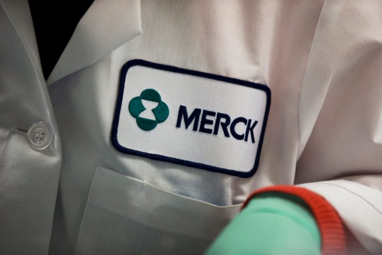 FILE - In this Thursday, Feb. 28, 2013 file photo, a Merck logo is placed on scientist's lab coat in West Point, Pa. The Food and Drug Administration on Thursday, Sept. 4, 2014 said it has granted accelerated approval to Merck's Keytruda, for treating melanoma that's spread or can't be surgically removed, in patients previously treated with another drug. (AP Photo/Matt Rourke, File)