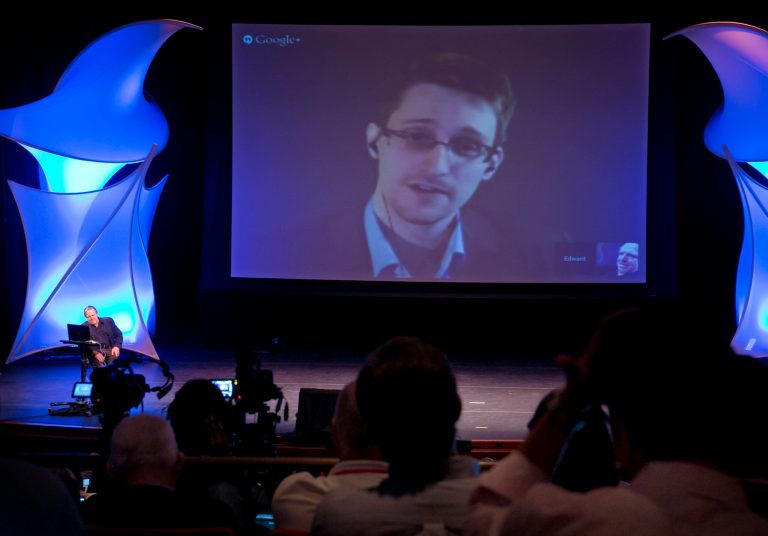 Former NSA contractor Edward Snowden participates in a conversation via video with John Perry Barlow, co-founder & vice chairman of the Electronic Frontier Foundation, at the 2014 Personal Democracy Forum, at New York University, Thursday, June 5, 2014 in New York. (AP Photo/Richard Drew)