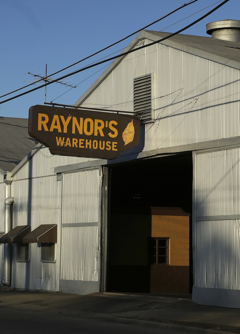 In this photo taken Friday, March 8, 2013, a tobacco warehouse owned by Roy Johnson Raynor is shown at 1441 S. Church Street in Rocky Mount, N.C. Raynor is one of 41 people who have either pleaded guilty or reached plea agreements after profiting from false insurance claims for losses of tobacco, soybeans, wheat and corn. Prosecutors say bulk tobacco supposedly destroyed by bad weather and pests was secretly sold under false by several brokers in eastern North Carolina, part of a massive crop insurance fraud conspiracy prosecutors say cost the government-backed program $100 million in false claims. Raynor pleaded guilty in 2010 to conspiring to make a false statement, making a material false statement and committing mail and wire fraud. He was sentenced to one year in federal prison for brokering $1.4 million in deals for the 
