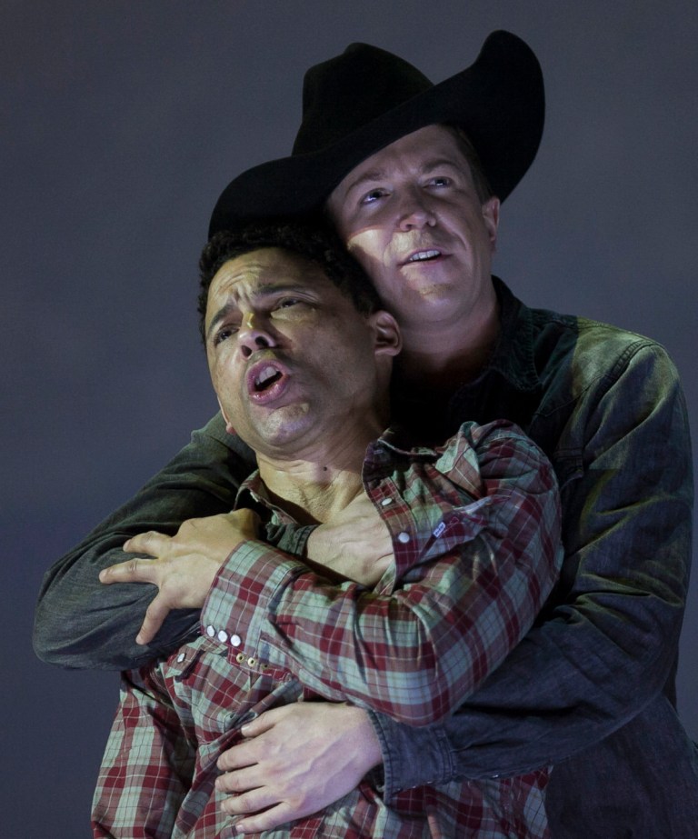 In this photo taken on Friday, Jan. 24, 2014, American tenor Tom Randle (Jack Twist), left, and Canadian bass-baritone Daniel Okulitch (Ennis del Mar), right,  perform during the press rehearsal of the production 