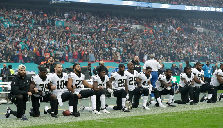 NFL team owners plan to talk next week about whether to alter the league's rules to require players to stand during the national anthem. (AP Photo/Matt Dunham)