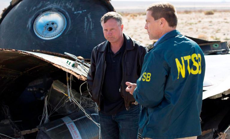 Virgin Galactic pilot Todd Ericson talks with National Transportation Safety Board investigator Joe Sedor at the SpaceShipTwo accident site near Mojave, Calif., Monday, Nov. 3, 2014. (AP Photo/National Transportation Safety Board)