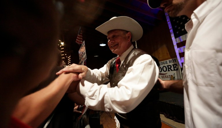 Former Alabama Chief Justice and U.S. Senate candidate Roy Moore speaks at a rally, Monday, Sept. 25, 2017, in Fairhope, Ala. (AP Photo/Brynn Anderson)