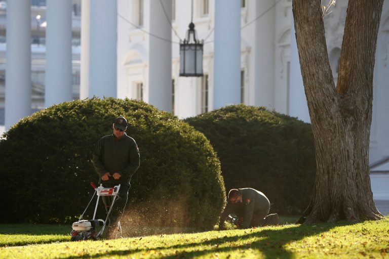 National Park Service employees tend to the North Lawn of the White House in Washington, Friday, Oct. 18, 2013, after a 16-day partial government shutdown was resolved by lawmakers late Wednesday. (AP Photo/Charles Dharapak)