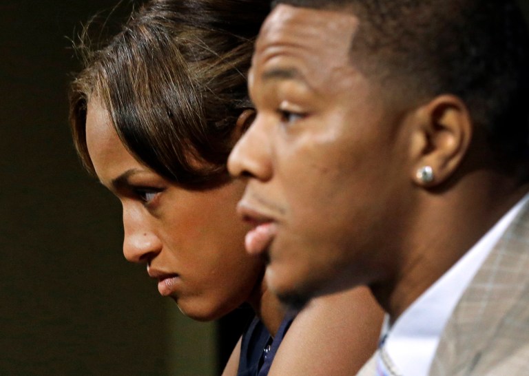 Janay Rice, left, looks on as her husband, Baltimore Ravens running back Ray Rice, speaks to the media during a news conference in Owings Mills, Md. (AP/Patrick Semansky)