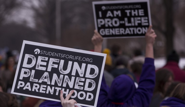 Pro-life demonstrators hold signs during the 46th annual March for Life in Washington, D.C., U.S., on Jan. 18, 2019. People from around the nation gathered in Washington D.C. today for the annual rally against abortion, which included a video message from President Trump and an address by Vice President Mike Pence.