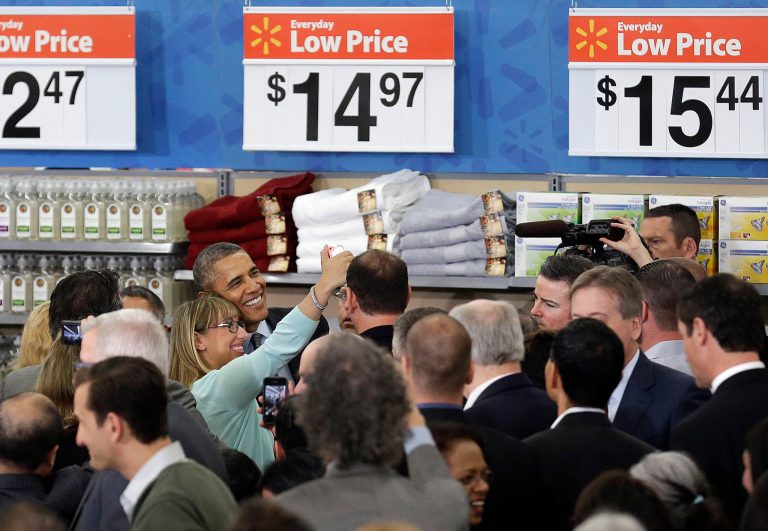 President Barack Obama poses for a selfie photo after speaking at a Walmart store in Mountain View, Calif., Friday, May 9, 2014. Obama announced new steps by companies, local governments and his own administration to deploy solar technology, showcasing steps to combat climate change that don't require consent from a disinclined Congress. (AP Photo/Jeff Chiu)