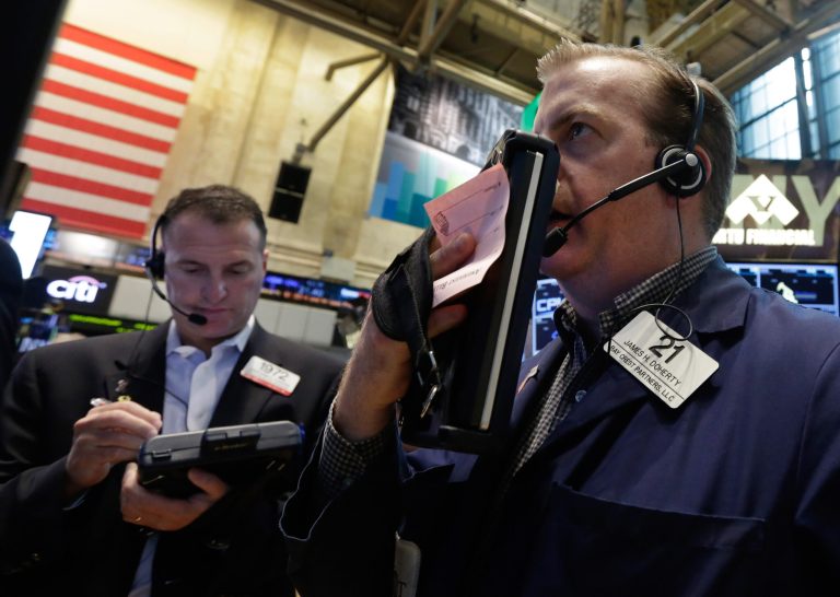 Traders Jonathan Corpina, left, and James Doherty work on the floor of the New York Stock Exchange Friday, May 30, 2014. Two negative reports on U.S. consumers were pushing stocks lower in early trading Friday. (AP Photo/Richard Drew)