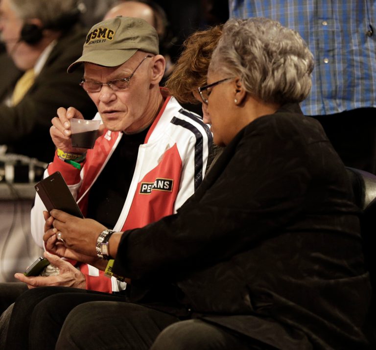 Interium Chairwoman of the Democratic National Committee Donna Brazile, right, speaks with Political commentator and media personality James Carville during the skills competition at the NBA All Star basketball game, Saturday, Feb. 15, 2014, in New Orleans. (AP Photo/Gerald Herbert)