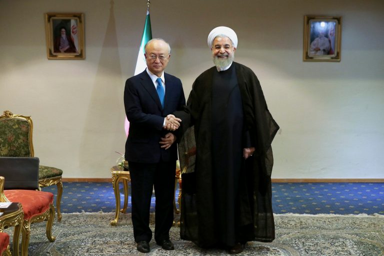 Iran's President Hassan Rouhani, right, shakes hands with the International Atomic Energy Agency's director-general, Yukiya Amano, as they pose for photos at the start of their meeting in Tehran, Iran, Thursday, July 2, 2015. (AP Photo/Ebrahim Noroozi)