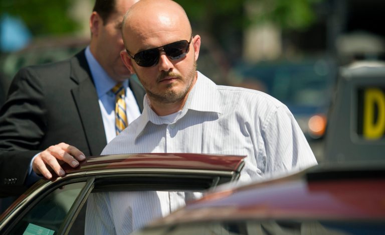 FILE - In this June 11, 2014, file photo, former Blackwater Worldwide guard Nicholas Slatten enters a taxi cab as he leaves federal court in Washington, after the start of his trial. After 10 weeks of argument and testimony, the case goes to the jury on Tuesday, Sept. 2, 2014. (AP Photo/Cliff Owen, File)