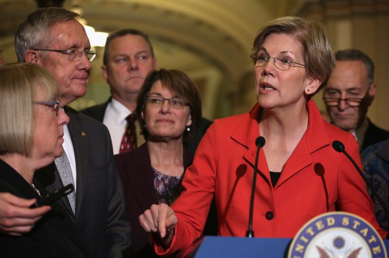 Influential congressional Democrats including Sen. Elizabeth Warren criticized the inclusion of roll-back of a Dodd-Frank provision added to the omnibus spending bill introduced Tuesday night. (Alex Wong/Getty images)