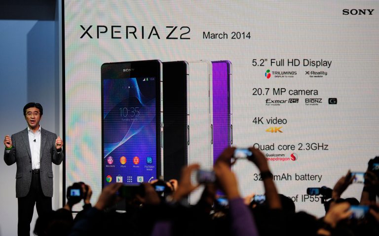 President and CEO of Sony Mobile Communications Kunimasa Suzuki presents the Smartphone Xperia Z2 during the Mobile World Congress, the world's largest mobile phone trade show in Barcelona, Spain, Monday, Feb. 24, 2014. Expected highlights include major product launches from Samsung and other phone makers, along with a keynote address by Facebook founder and chief executive Mark Zuckerberg. (AP Photo/Manu Fernandez)
