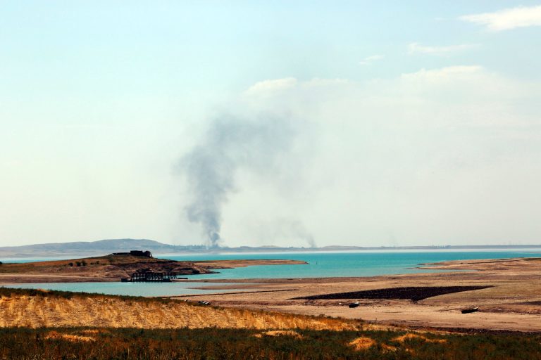 In this Monday, Aug. 18, 2014 file photo, smoke rises during airstrikes targeting Islamic State militants at the Mosul Dam outside Mosul, Iraq. (AP Photo/Khalid Mohammed, File)