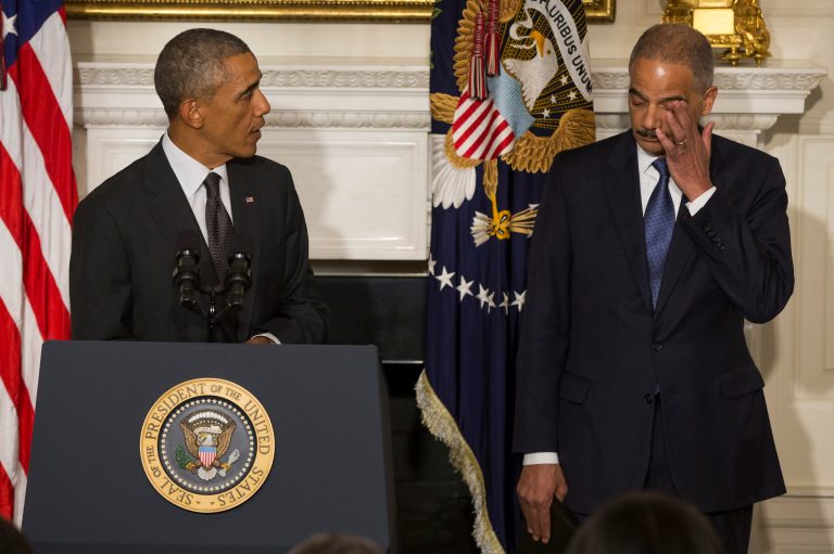 President Barack Obama, accompanied by Attorney General Eric Holder, speaks in the State Dining Room of the White House in Washington, Thursday, Sept. 25, 2014, to announce Holder is resigning. Holder, who served as the public face of the Obama administration's legal fight against terrorism and weighed in on issues of racial fairness, is resigning after six years on the job. He is the first black US attorney general. (AP Photo/Evan Vucci)
