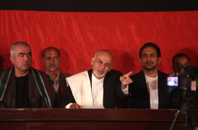 Afghanistan's presidential candidate Ashraf Ghani Ahmadzai, center, asks a cameraman to move to the right side, during an event at his residence in Kabul, Afghanistan, Wednesday, June 25, 2014. Ashraf Ghani Ahmadzai, called on Abdullah to rejoin the process and demanded that the commission stick to the official timetable for releasing preliminary results next week. (AP Photo/Massoud Hossaini)