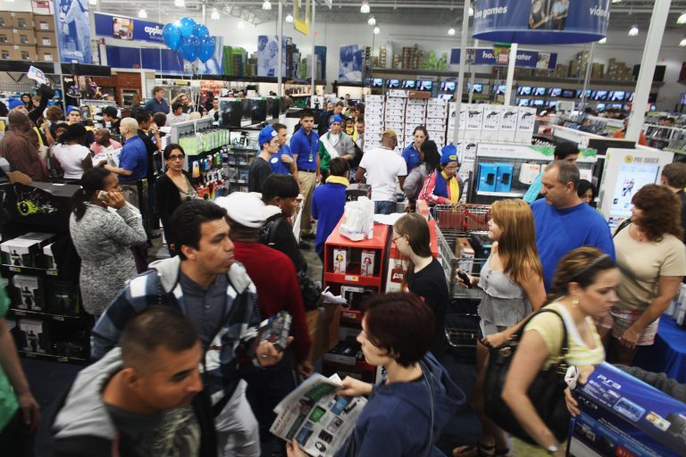 This Black Friday, economic reality is putting additional pressures on both the consumer and the worker. The former feels pressure to get something cheap; the latter has little choice but to forgo travel and work over the holiday. (Getty File image/Spencer Platt)