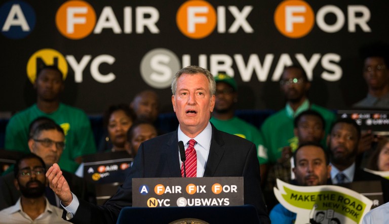 New York Mayor Bill de Blasio speaks at a rally where he announces a plan to fund MTA improvements on Monday, Aug. 7, 2017, in New York. De Blasio wants to tax the wealthiest 1 percent of city residents to fund repairs and improvements to the nation's largest subway system. (AP Photo/Michael Noble Jr.)