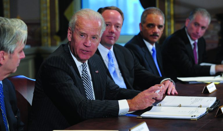 Vice President Joe Biden, second from left, with Attorney General Eric Holder, second from right, speaks during a meeting with representatives from the video game industry in the Eisenhower Executive Office Building on the White House complex in Washington, Friday, Jan. 11, 2013. Biden is holding a series of meetings this week as part of the effort he is leading to develop policy proposals in response to the Newtown, Conn., school shooting. Entertainment Software Association President Mike Gallagher sits between Biden and Holder. (AP Photo/Susan Walsh)