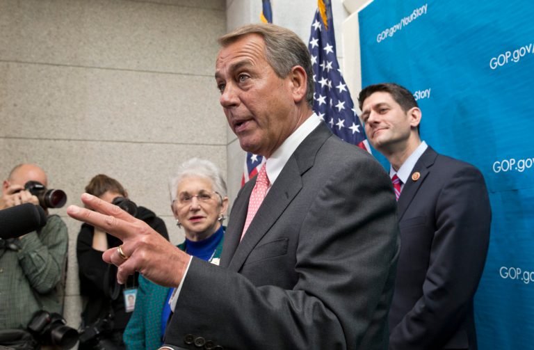 House Speaker John Boehner of Ohio answers questions about the Ryan-Murray budget deal as Rep. Paul Ryan, R-Wis., looks on, in Washington on Wednesday. (AP Photo/J. Scott Applewhite)