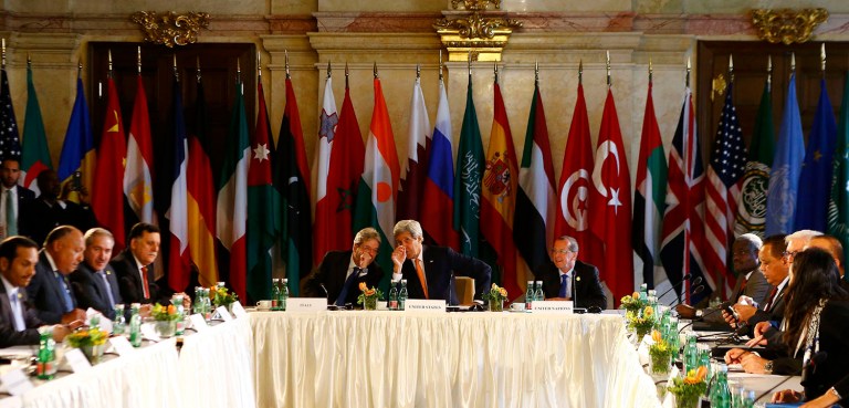 U.S. Secretary of State John Kerry, Italian Foreign Minister Paolo Gentiloni, left, and U.N. Libya envoy Martin Kobler attend the ministerial meeting on Libya in Vienna, Austria, Monday May 16, 2016. (Leonhard Foeger/Pool Photo via AP)