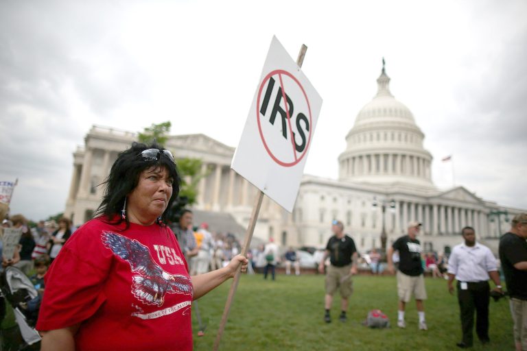 A protester holds a sign while participating in a Tea Party rally against the IRS at the U.S. Capitol earlier this month.  (Mark Wilson/Getty Images)