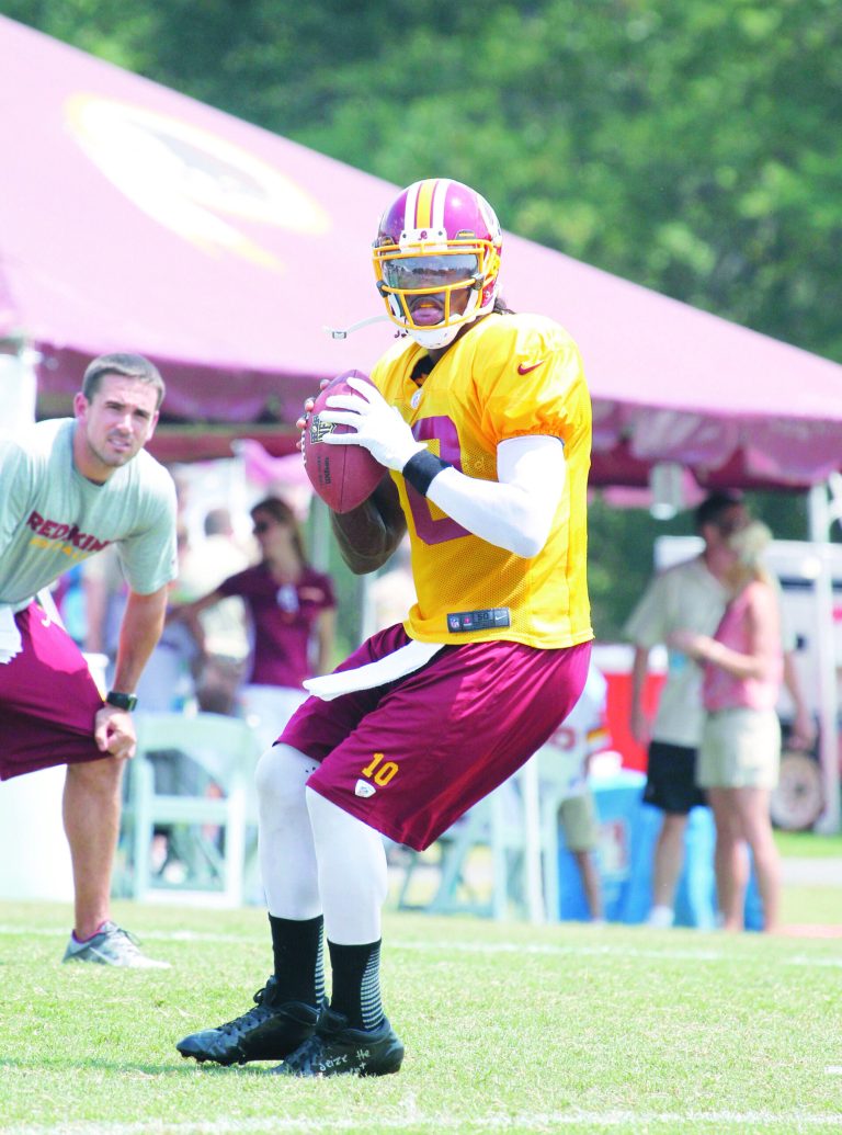 Jennifer Milbrett/The Washington Examiner
Through the first 10 days of practice, quarterback Robert Griffin III has shown some indecisiveness in the pocket.