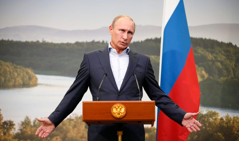 Russian President Vladimir Putin gestures while speaking during a media conference after a G-8 summit in Enniskillen, Northern Ireland, on June 18. (AP Photo/Matt Dunham, Pool)