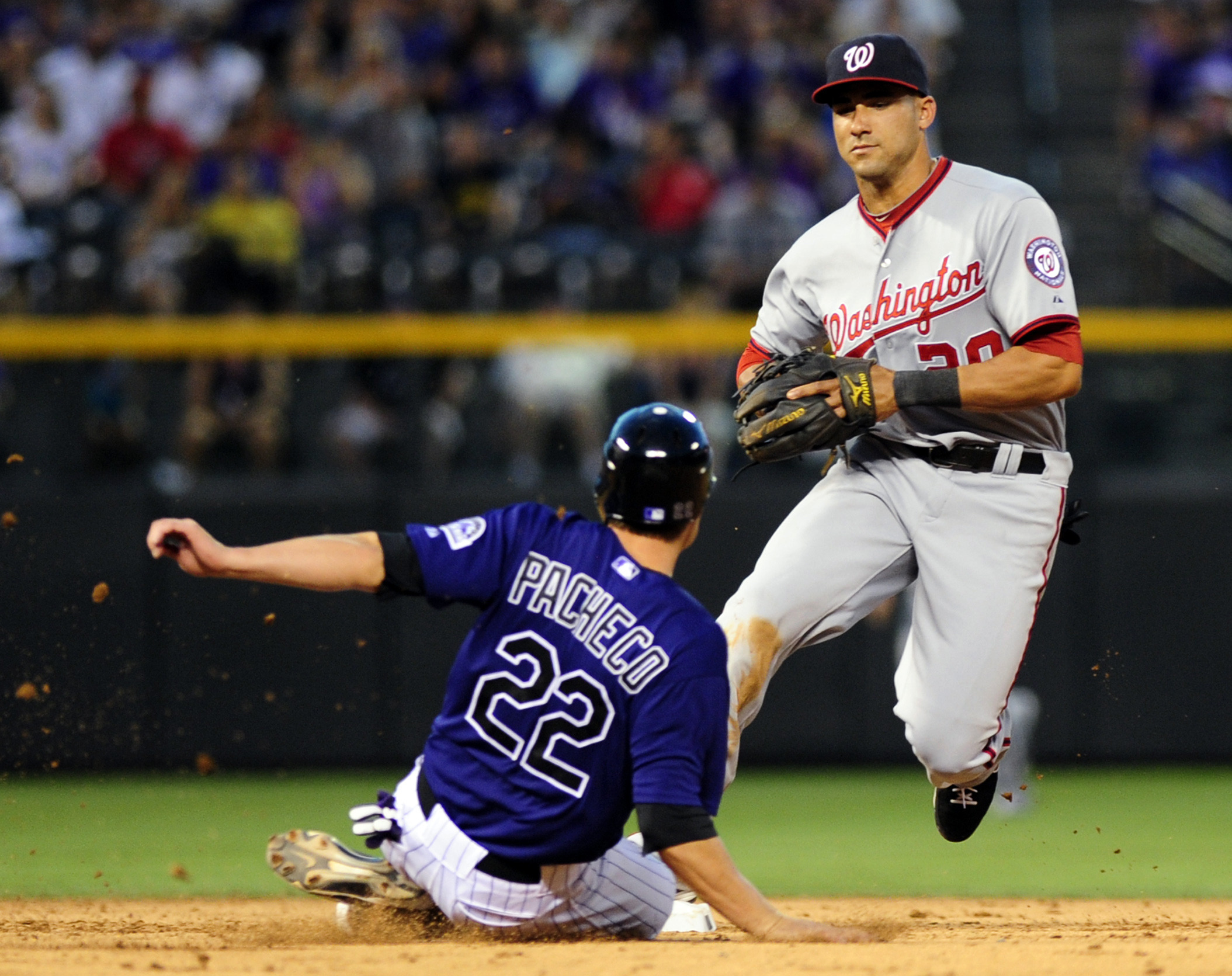 Helton helps Rockies beat Strasburg, Nationals 4-2