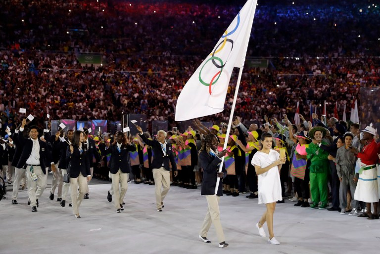 Earlier this month in the Olympic Opening Ceremony, the world saw Rose Nathike Lokonyen, 23, a South Sudanese runner, stride into Maracana stadium bearing the flag of the International Olympic Committee and leading the way for the first ever Refugee Olympic Team. (AP Photo/David J. Phillip)