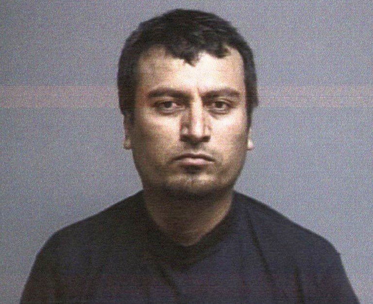 This booking photo released Tuesday, July 28, 2015, by the Lake County Sheriff's Department shows Juan Emmanuel Razo, 35, arrested after a shootout with deputies in Painesville Township, Ohio. (AP Photo)Â 