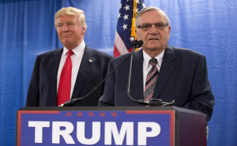Republican presidential candidate Donald Trump, left, is joined by Maricopa County, Ariz., Sheriff Joe Arpaio during a new conference at the Roundhouse Gymnasium, Tuesday, Jan. 26, 2016, in Marshalltown, Iowa. Supporters want him named head of the Border Patrol. (AP Photo/Mary Altaffer)
