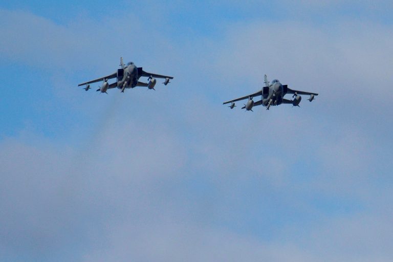 Two British Tornados warplanes fly over the RAF Akrotiri, a British air base near costal city of Limassol, Cyprus, Thursday, Dec. 3, 2015, as they arrive from an airstrike against Islamic State group targets in Syria. (AP Photo/Pavlos Vrionides)