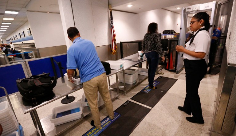 Last year, the TSA found a record high 3,957 guns in passenger carry-on bags, nearly five times the number seized a decade ago. (AP Photo/Wilfredo Lee)