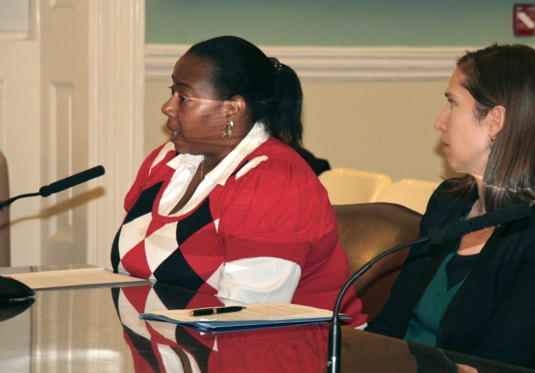 Caregiver Dena Adams, left, accompanied by attorney Phoebe Taubman, testifies before the New York City Council Civil Rights Committee. (AP Photo/A Better Balance)