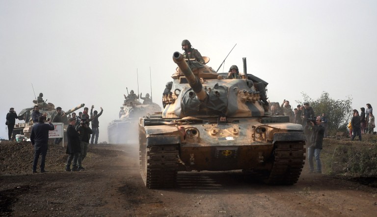 Turkish army tanks enter Afrin, an enclave in northern Syria controlled by U.S.-allied Kurdish fighters, in Hassa, Hatay, Turkey, Monday, Jan. 22, 2018. Turkey's President Recep Tayyip Erdogan has said his country will 