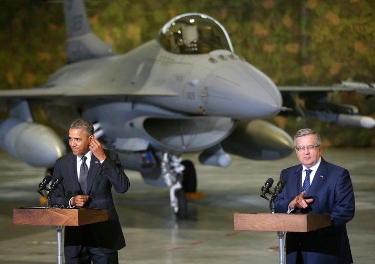 U.S. President Barack Obama and Poland's President Bronislaw Komorowski make statements and meet with U.S. and Polish troops at an event featuring four F-16 fighter jets, two American and two Polish, as part of multinational military exercises, in Warsaw, Poland, Tuesday, June 3, 2014. (AP Photo/Charles Dharapak)