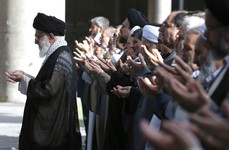 In this picture released by the official website of the office of the Iranian supreme leader, Supreme Leader Ayatollah Ali Khamenei, leads the Eid al-Fitr prayer at the Imam Khomeini grand mosque, in Tehran, Iran, Tuesday, July 29, 2014. (AP Photo/Office of the Iranian Supreme Leader)