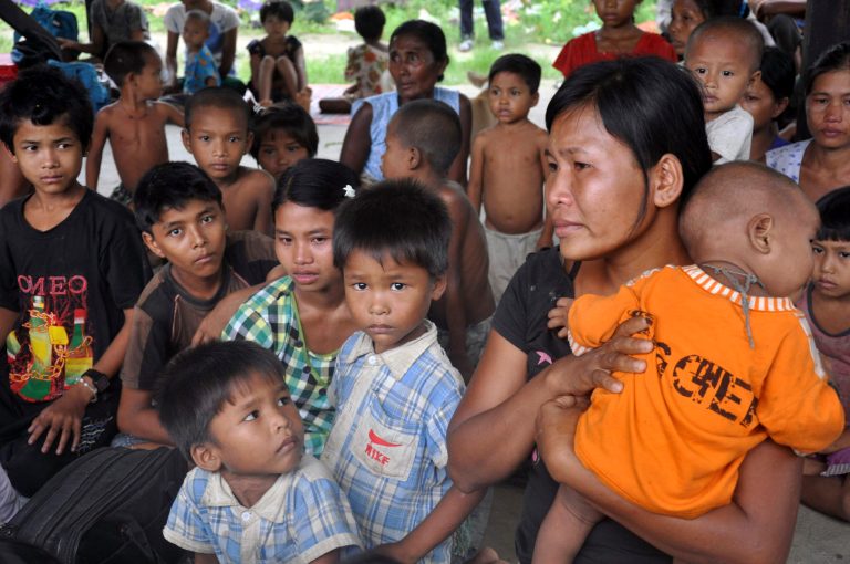   Local residences taking refuge at a monastery in Sittwe, capital of Rakhine state in western Myanmar, where sectarian violence is impacting on the local population Monday Junee 11, 2012. The Buddhist-Muslim violence, which has left at least seven people dead and hundreds of homes torched since Friday, poses one the biggest tests yet for Myanmar's new government as it struggles to reform the nation after generations of military rule. (AP Photo/Khin Maung Win)  