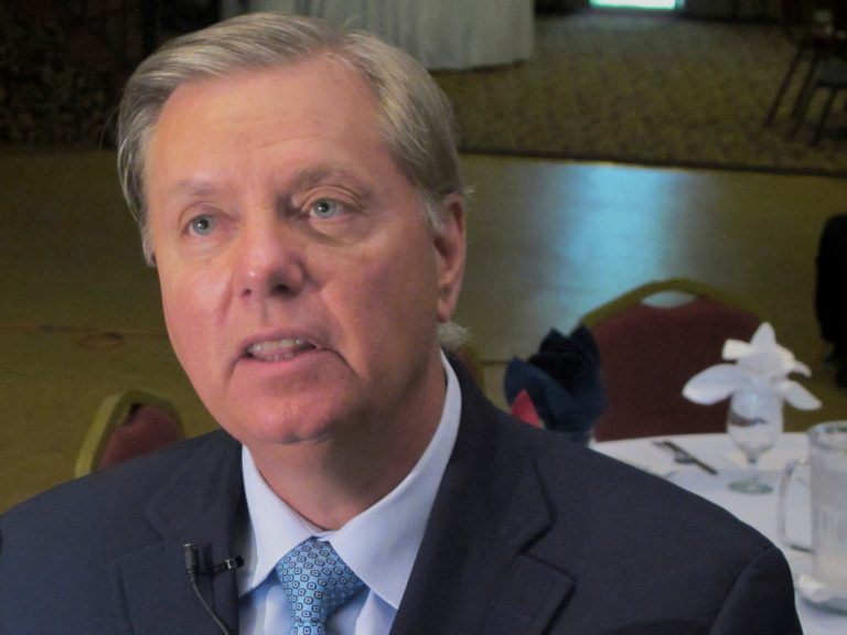 FILE - In this Sept. 3, 2013 file photo Sen. Lindsey Graham, R-S.C. talks to a reporter following a speech in Goose Creek, S.C. The White House on Wednesday April 30, 2014 denied that a staff memberÃ?s email three days after the deadly attack on the U.S. mission at Benghazi, Libya, was actually about the attack Graham, has called the email a Ã?smoking gunÃ? that Ã?shows political operatives in the White House working to create a political narrative at odds with the facts.Ã? (AP Photo/Bruce Smith, File)