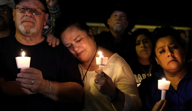 Community members come together for a candlelight vigil for the victims of a deadly church shooting in Sutherland Springs, Texas, Sunday, Nov. 5, 2017. (AP Photo/Laura Skelding)